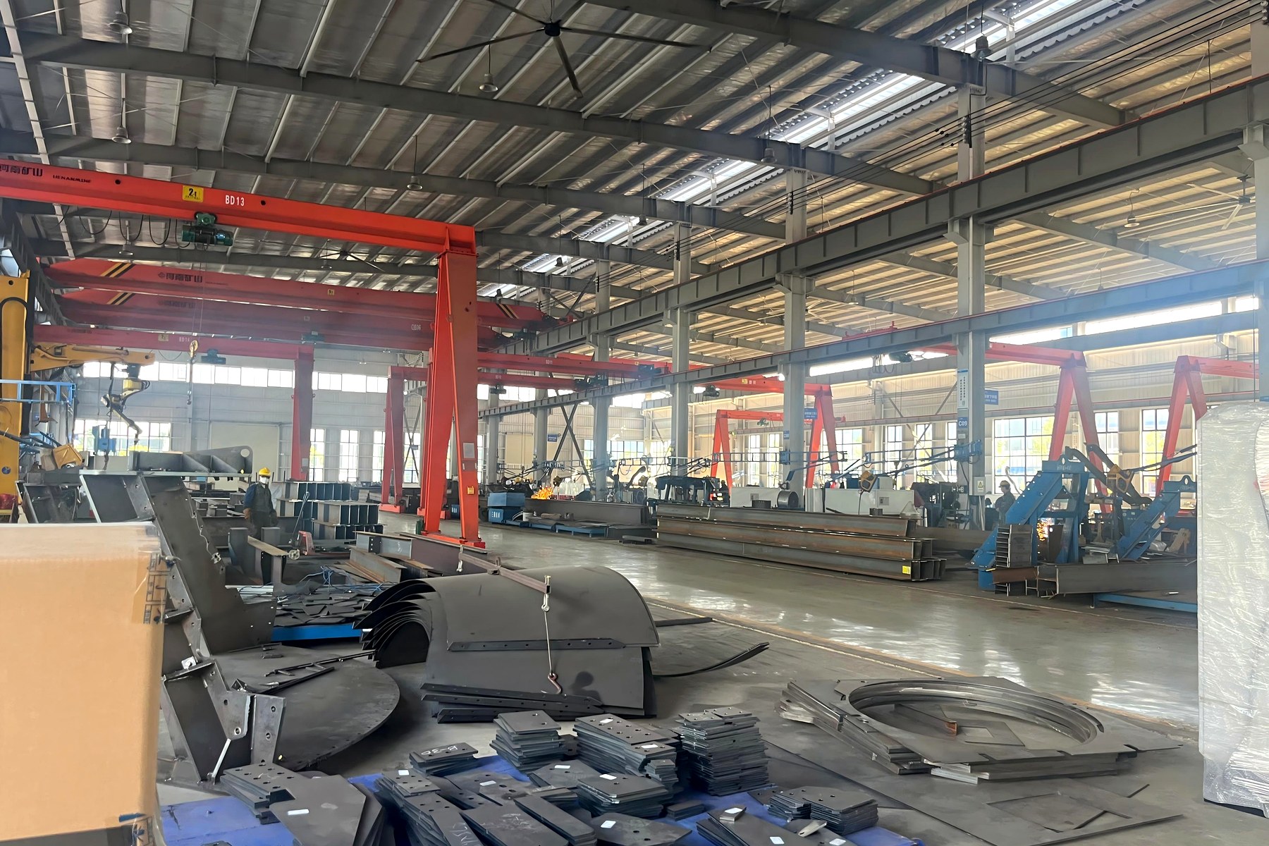 Cement silo manufacturing workshop with steel processing equipment