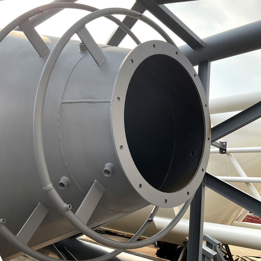 Close view of a custom silo outlet connection and surrounding access frame