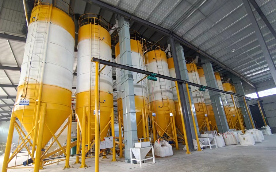 Dry mortar silos inside a production facility
