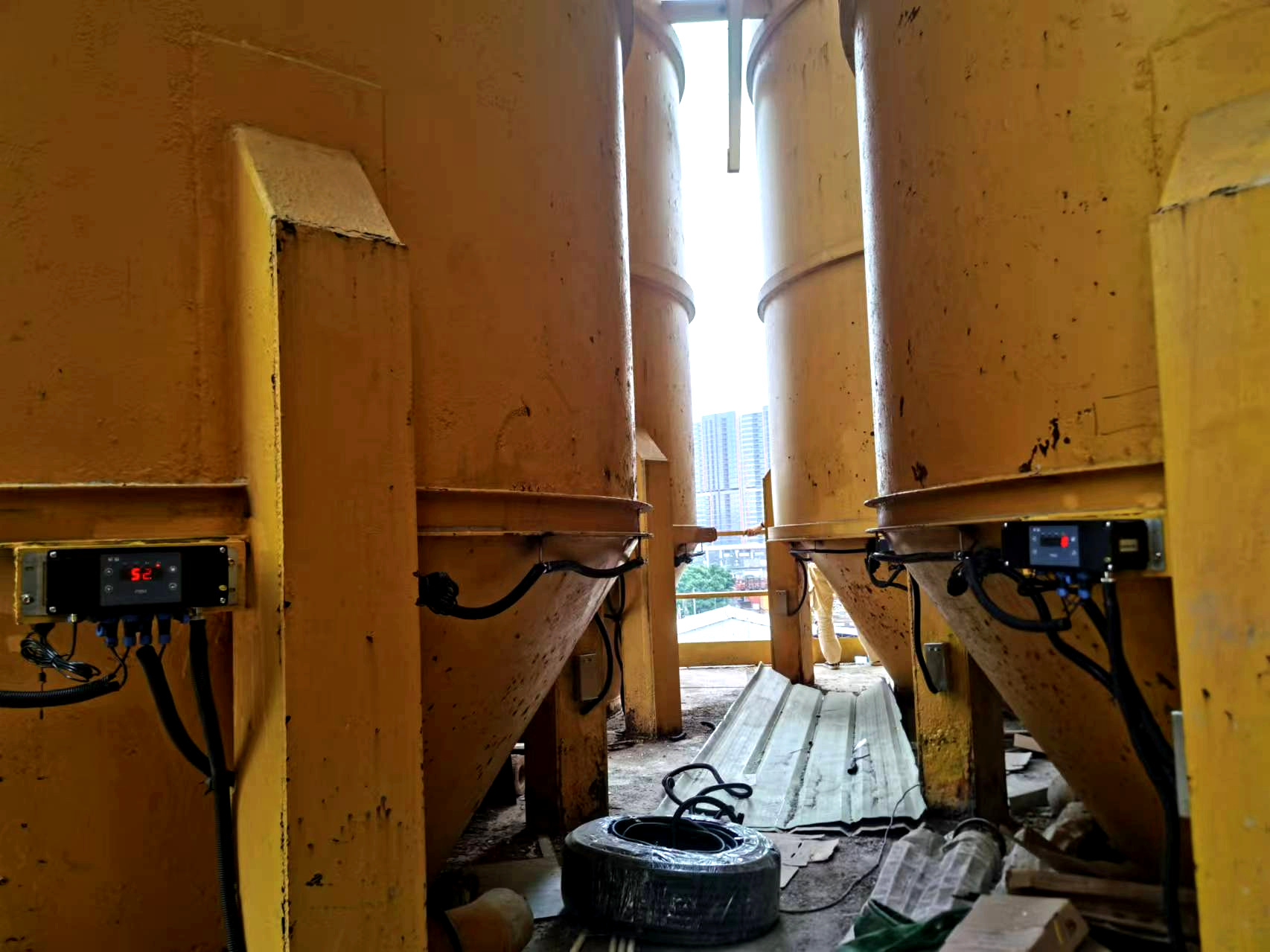 Silo weighing system displays and wiring installed on storage hoppers
