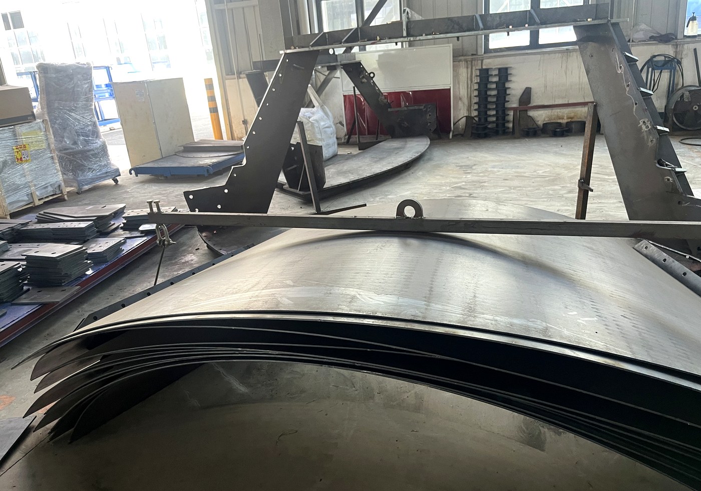 Curved cement silo body panels before coating and assembly