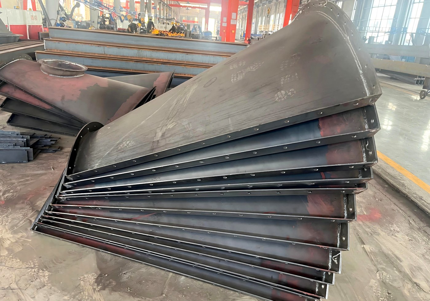 Nested bolted silo panels prepared for container loading